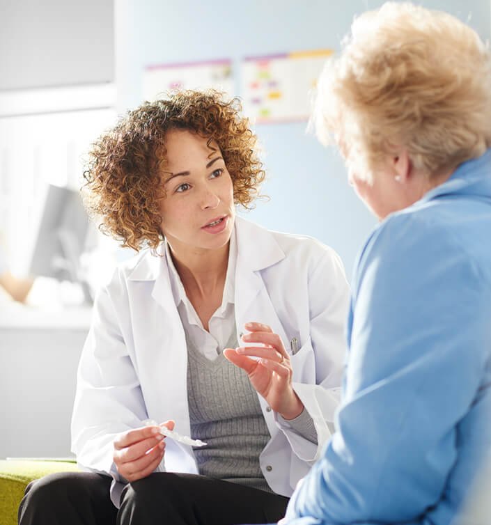 Nurse providing IV drip at home